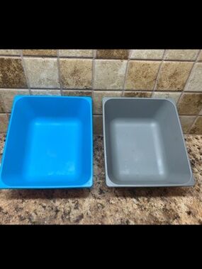 IKEA VARIERA blue and grey plastic square cereal bowls.